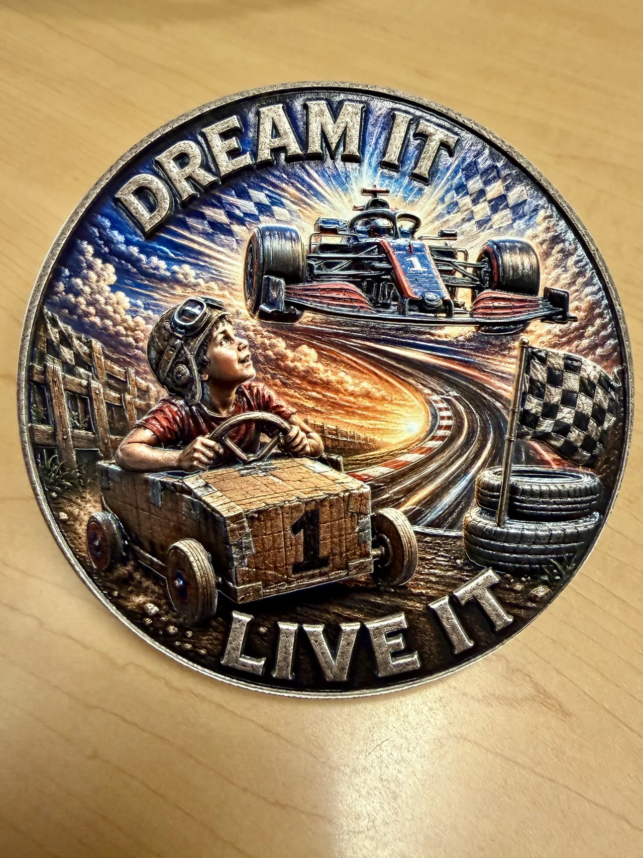Creator-uploaded photograph presenting the completed Dream It Live It artwork on a wooden surface